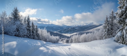 Snowy mountain slope path, winter landscape, sunny day, valley view, travel postcard