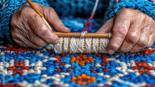 Close-up of hands weaving colorful threads into a patterned textile.