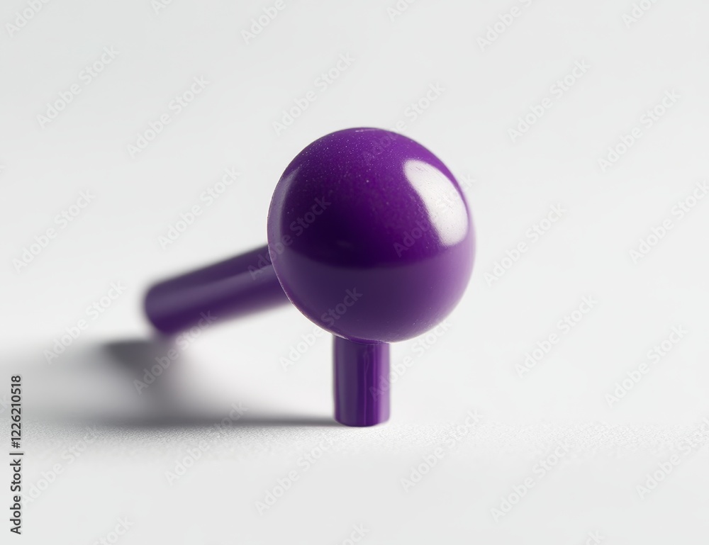 Purple plastic knob with stem on white background. Purple plastic knob with stem on white background.