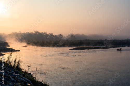 misty morning on the river in Sauraha, Nepal. photo