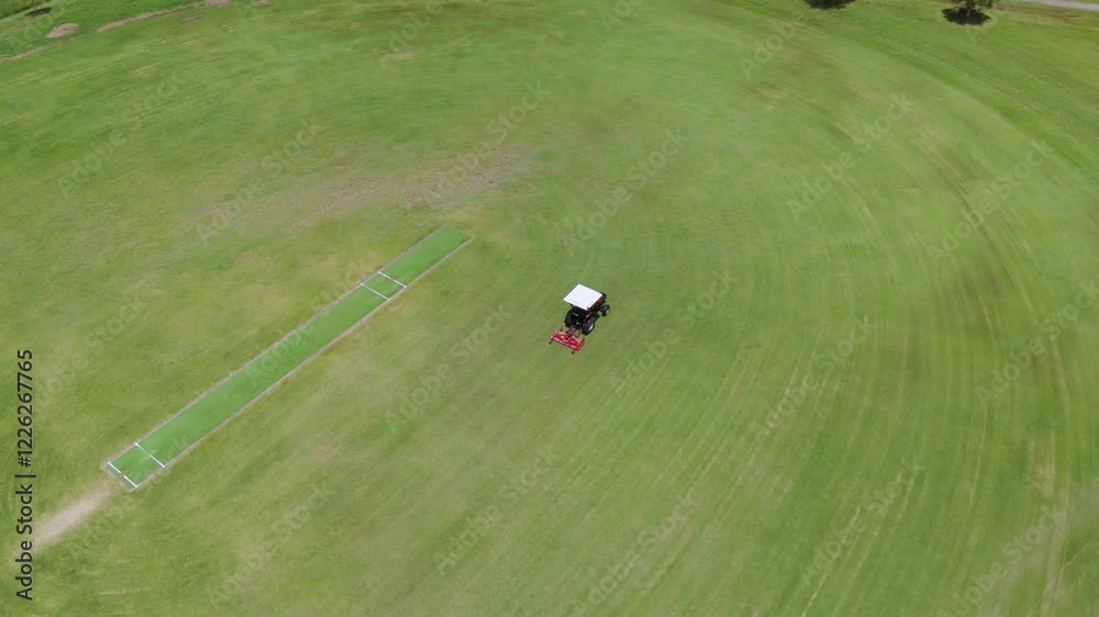Mowing a Sports Field with Tractor Mowing a Sports Field with Tractor