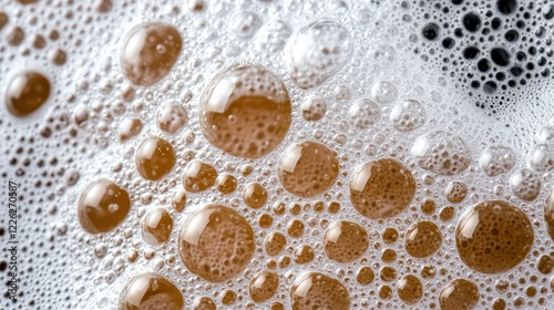 Close-up of bubbles in a frothy liquid, showcasing texture and color.