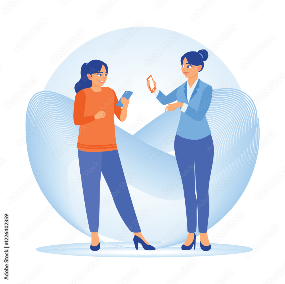 Fototapeta premium Two women use a smartphone together.
