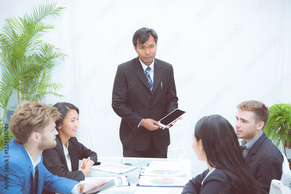 Fototapeta premium Group of team young business and executive discussing for planning marketing and strategy of financial at the office, manager and employee meeting for seminar about finance, at the conference room.