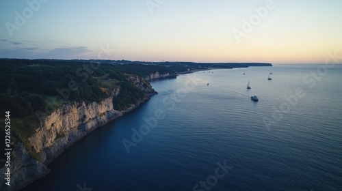 Wallpaper Mural 19.From the top of EckmÃ¼hl Lighthouse, a panoramic view unfolds with the deep blue sea stretching toward the horizon. Ships sail by in the distance, and the rugged coastline curves gently, creating a Torontodigital.ca