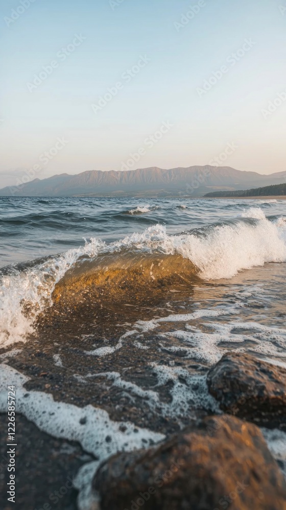 Fototapeta premium Serene Ocean Waves Crashing on Rocky Shore Coastal Landscape