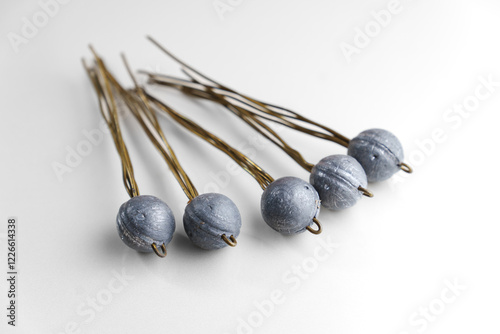 Old lead fishing sinkers on a white background. fishing tools. photo