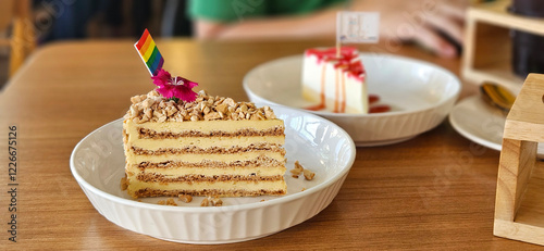 Obraz na płótnie Sans Rival Cake serving with mini flag in the coffee shop w salonie