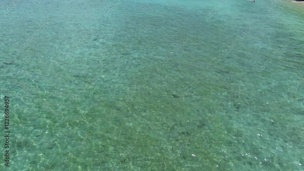 Aerial drone view of Gili Trawangan's stunning beach. Crystal-clear waters on white sand beach on vibrant island scenery, famous travel destination with stunning nature landscape. Aerial drone view of Gili Trawangan's stunning beach. Crystal-clear waters on white sand beach on vibrant island scenery, famous travel destination with stunning nature landscape.