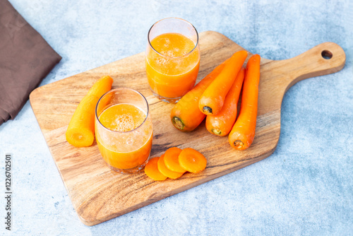 Carrot juice is a sweet, nutrient-rich beverage made from fresh carrots, packed with vitamins, antioxidants, and natural sweetness. photo