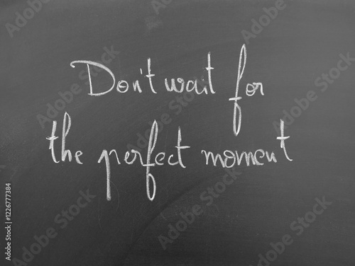 Don't wait for the perfect moment, motivational quote written on a chalkboard photo