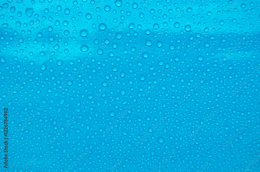 Fototapeta premium Top view of water droplets with light blue color background suitable for wallpaper