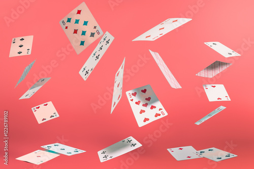 flying playing cards on a turquoise background photo