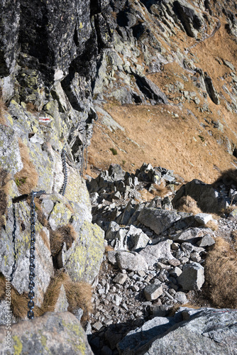 Climbing, high mountain trekking in the High Tatras. Belay elements in the mountains, buckles, chains and ladders.
