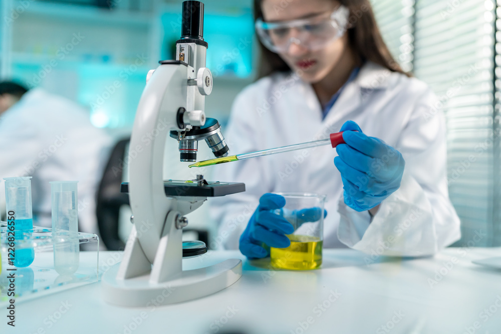 Asian female scientist working in biotechnology research laboratory. Asian female scientist working in biotechnology research laboratory.