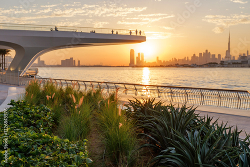 Obraz na plátně Stunning sunset view of Downtown Dubai skyline from Dubai Creek Harbour, UAE, ca