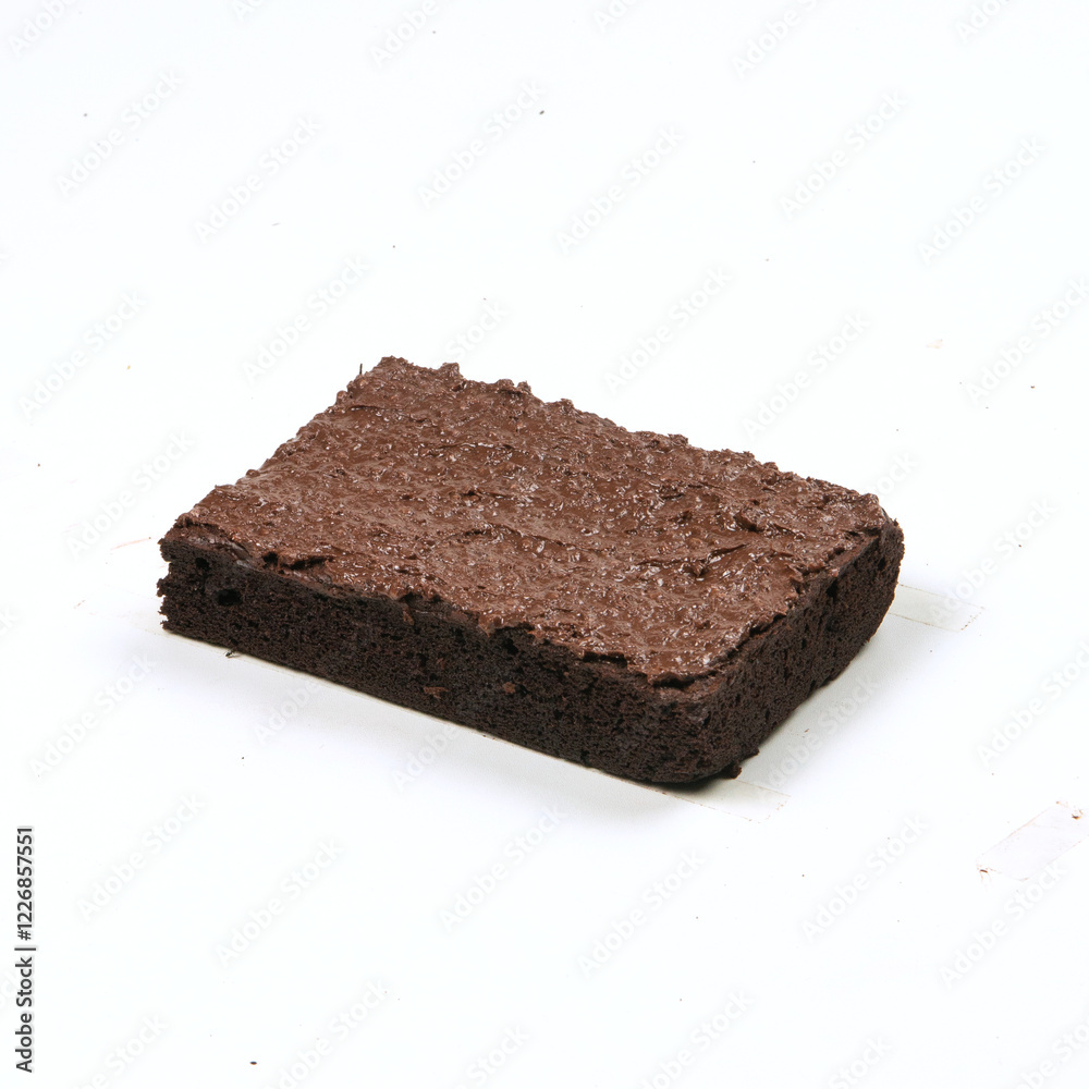 A moist chocolate brownie topped with smooth chocolate frosting sits elegantly on a plain surface, ideal for dessert enjoyment A moist chocolate brownie topped with smooth chocolate frosting sits elegantly on a plain surface, ideal for dessert enjoyment