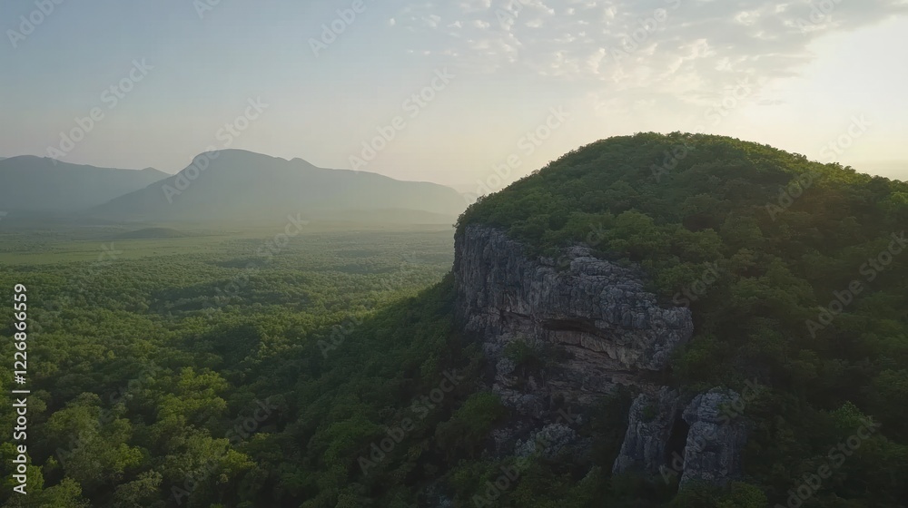 Fototapeta premium Majestic Mountaintop at Sunrise: An Aerial View of Serene Landscape
