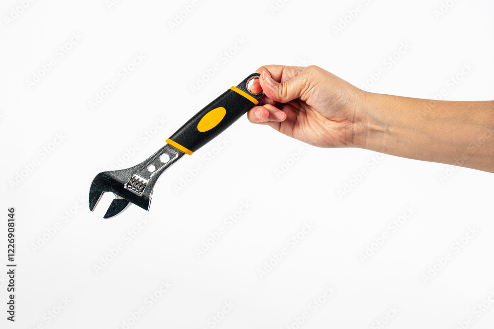 Hand holding a wrench isolated on white background. Hand holding a wrench isolated on white background.