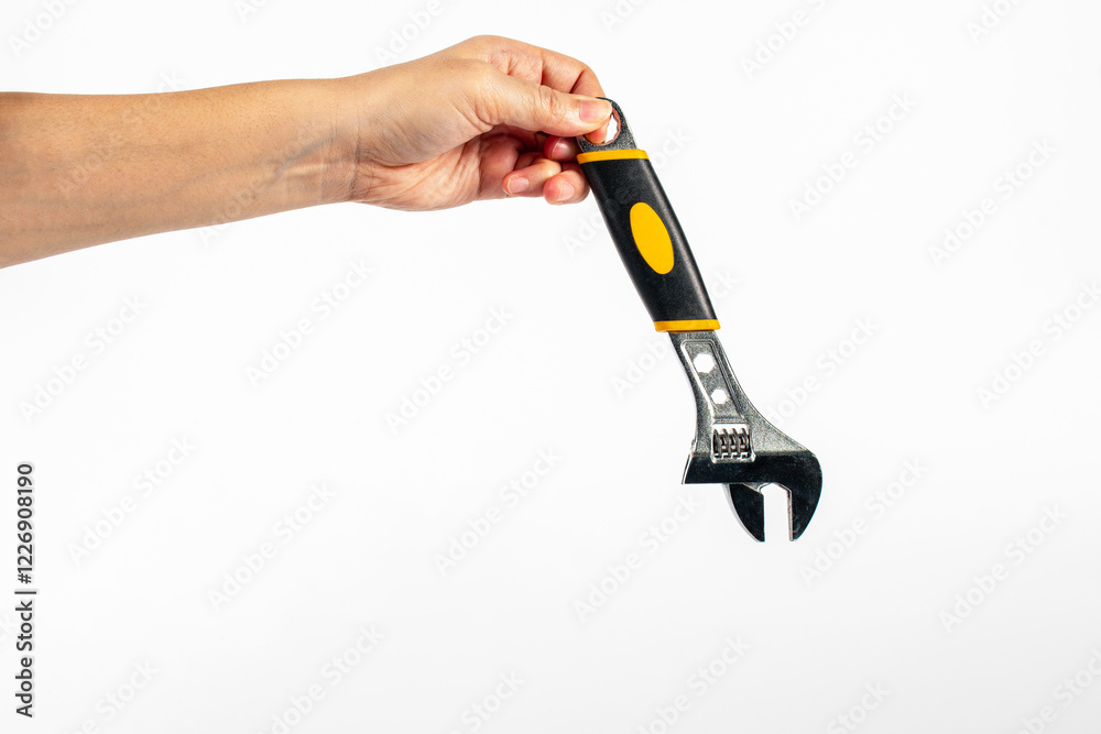 A wrench and hand isolated on white background. A wrench and hand isolated on white background.