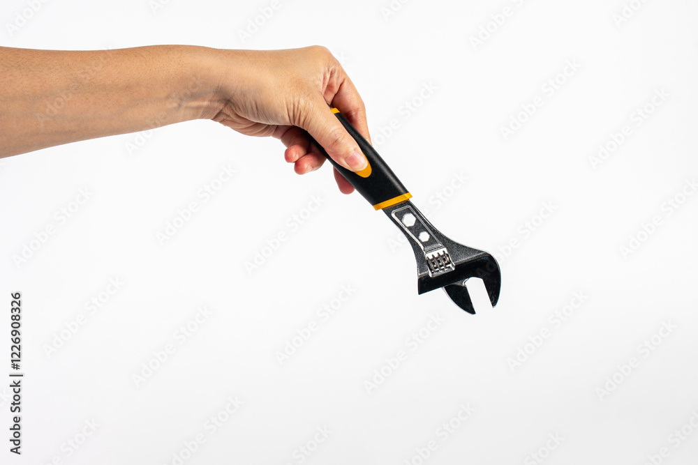 Hand holding a wrench isolated on white background. Hand holding a wrench isolated on white background.