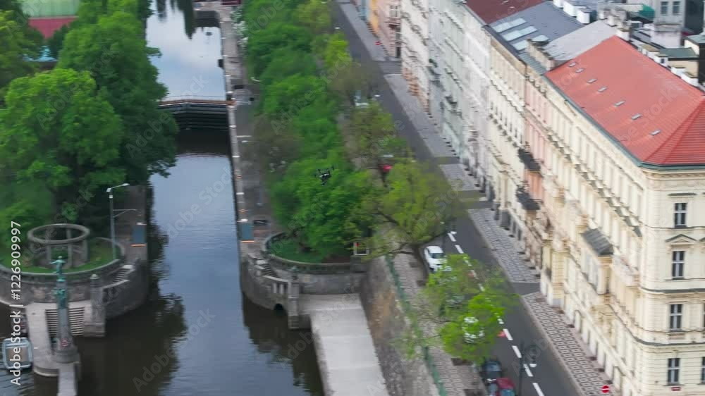 Aerial view of drone fly among buildings and over Vltava river, Czechia Aerial view of drone fly among buildings and over Vltava river, Czechia