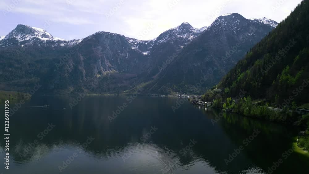 Explore a tranquil mountain lake surrounded by Alpine peaks and cozy lakeside cabins. Perfect for relaxation and breathtaking nature views. Explore a tranquil mountain lake surrounded by Alpine peaks and cozy lakeside cabins. Perfect for relaxation and breathtaking nature views.