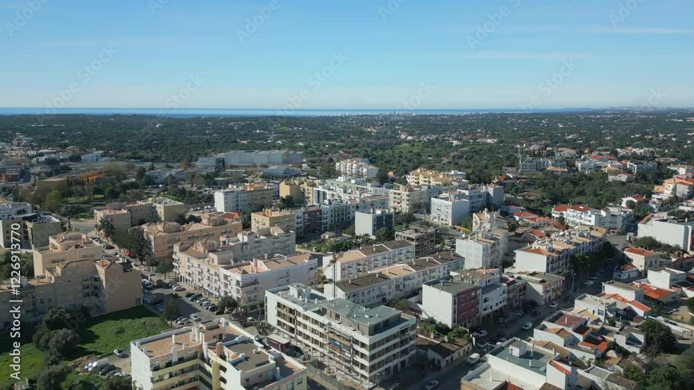 Aerial establishing shot of residential buildings in Almancil scenery, Algarve Aerial establishing shot of residential buildings in Almancil scenery, Algarve