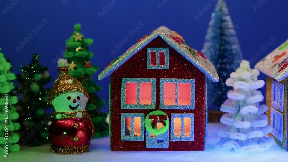 A small Christmas village with red, green and blue-brown houses A small Christmas village with red, green and blue-brown houses