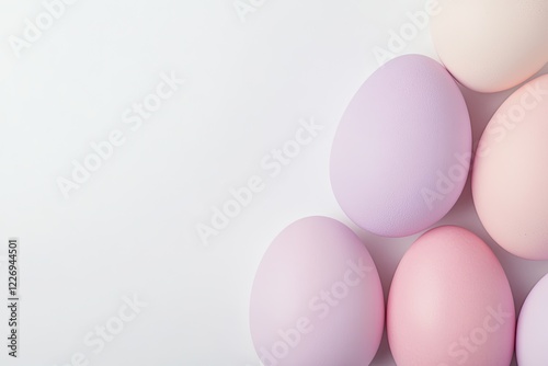 set of pastel lavender and pink easter eggs carefully arranged on clean white background with soft shadows photo