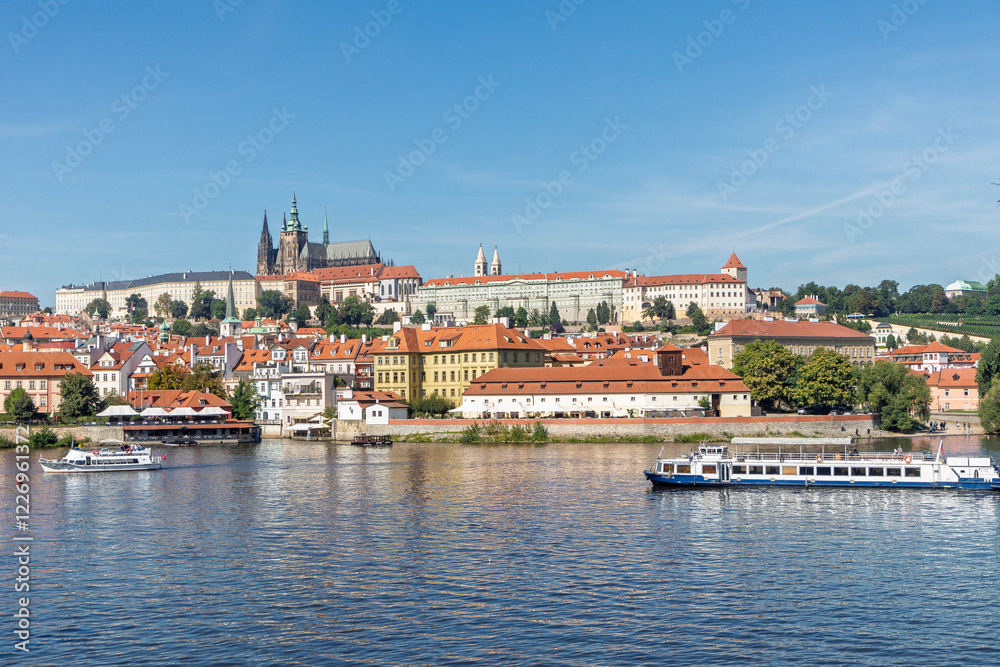 Spring Prague gothic Castle with the Lesser Town above River Vltava in the sunny Day, Czech Republic Spring Prague gothic Castle with the Lesser Town above River Vltava in the sunny Day, Czech Republic