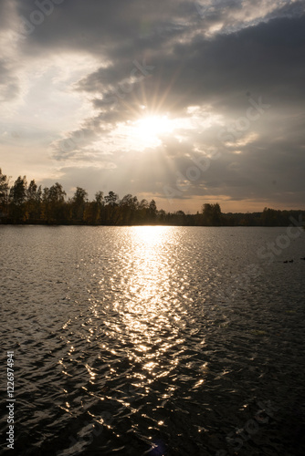 Picturesque sunset on the river in autumn