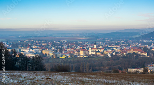 Obraz na płótnie Aerial view of Moravska Trebova with its scenic panorama. The town is surrounded by rolling hills and dense forests, showcasing the harmony of historic architecture and Czech nature w salonie