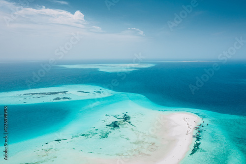 Obraz na płótnie Zanzibar, Aerial view of turquoise lagoon, white sand beach, and boats. w salonie