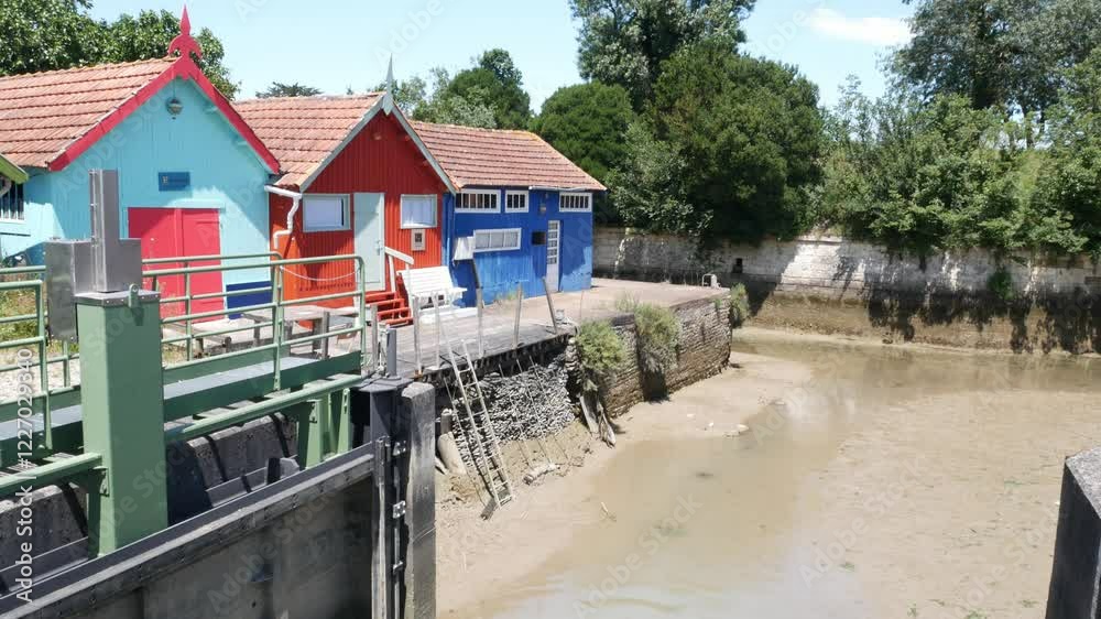 The colourful oyster farmers sheds in Chateau d'Oleron, France The colourful oyster farmers sheds in Chateau d'Oleron, France