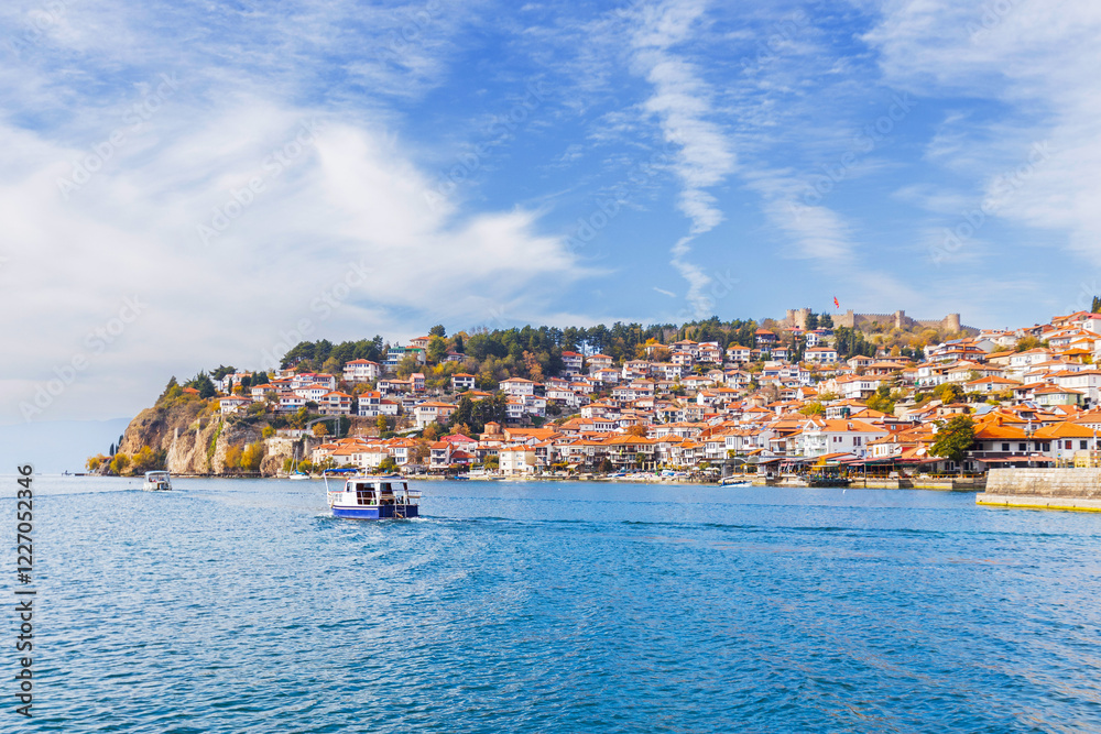 Picturesque view of Ohrid, North Macedonia, a historic town on Lake Ohrid shore, known for its charming architecture and stunning lake views, making it a popular tourist destination. Picturesque view of Ohrid, North Macedonia, a historic town on Lake Ohrid shore, known for its charming architecture and stunning lake views, making it a popular tourist destination.