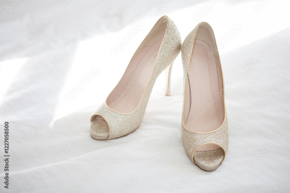 Naklejka premium wedding shoes on a bed