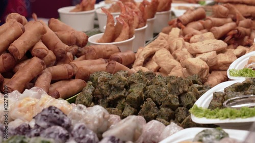 Various types of finger foods selling in the food market stall.