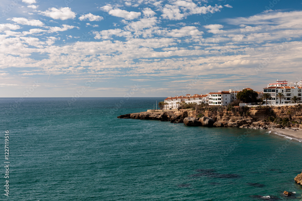 Coastal mediterranean town with cliffside buildings