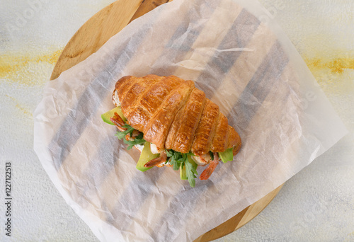 fresh croissant with filling on background