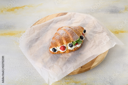 fresh croissant with filling on background
