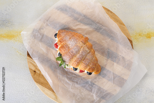 fresh croissant with filling on background