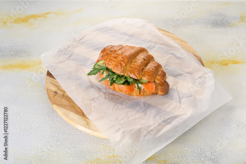 fresh croissant with filling on background