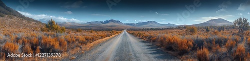 The gravel road meanders through the countryside, ending in the majestic rugged peaks of the Flinders Ranges mountains in South Australia
