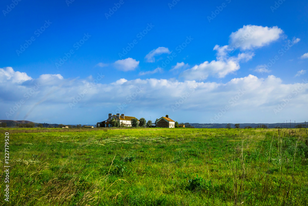 Old farm house on the plains with blue skies. Fields on the old farmland of Cardiga - Ribatejo - Portugal Old farm house on the plains with blue skies. Fields on the old farmland of Cardiga - Ribatejo - Portugal