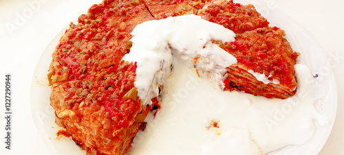 Traditional Turkish Food Kayseri Yalama with Minced Meat, Yogurt and Tomato Paste photo