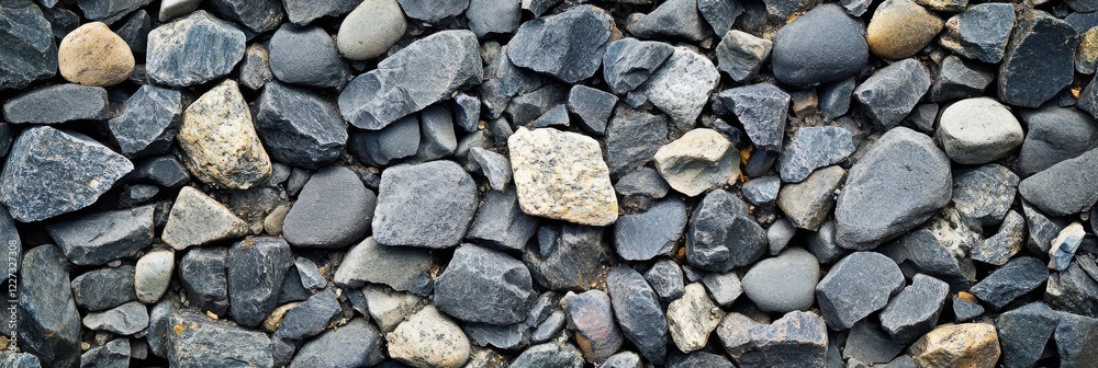 Textured arrangement of various gray stones and rocks for background concept Textured arrangement of various gray stones and rocks for background concept