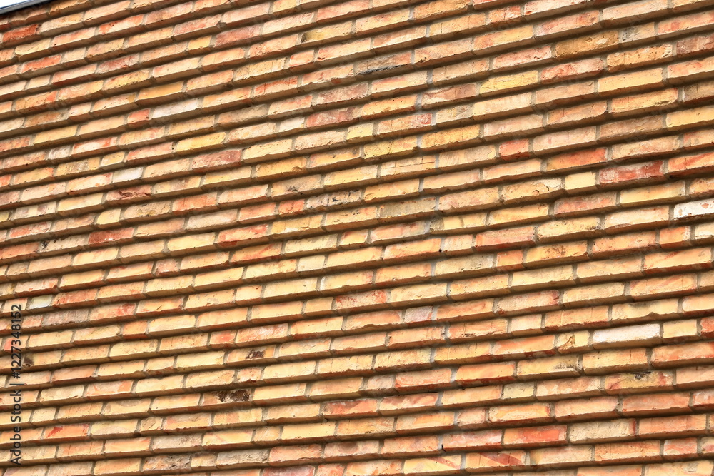Old brick wall, old texture of red orange stone blocks Old brick wall, old texture of red orange stone blocks