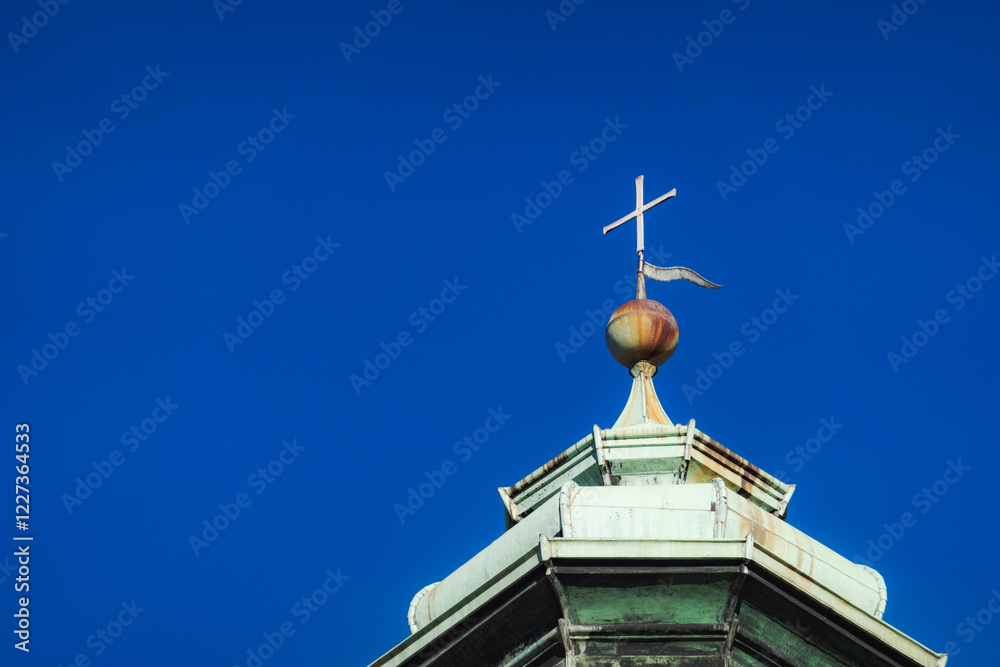 Church Steeple with Cross Against Clear Blue Sky Church Steeple with Cross Against Clear Blue Sky