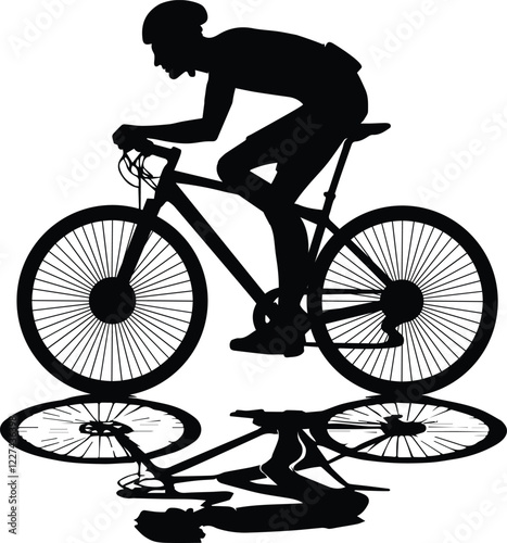 silhouette of a person riding a bicycle - Silhouette of a cyclist photo